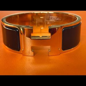 Hermès Clic Clac H Bracelet in Black/Gold tones.